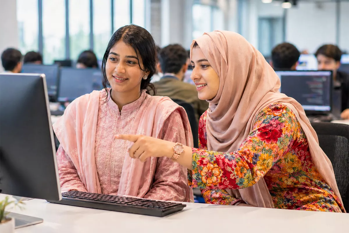 Students working together at a computer in the SuperTech lab